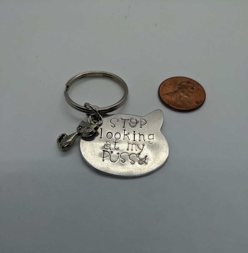 Hand-stamped aluminum cat-shaped keychain
