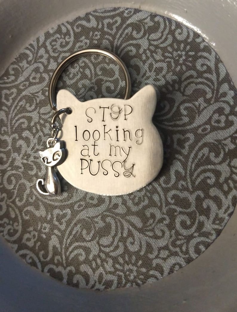Hand-stamped aluminum cat-shaped keychain
