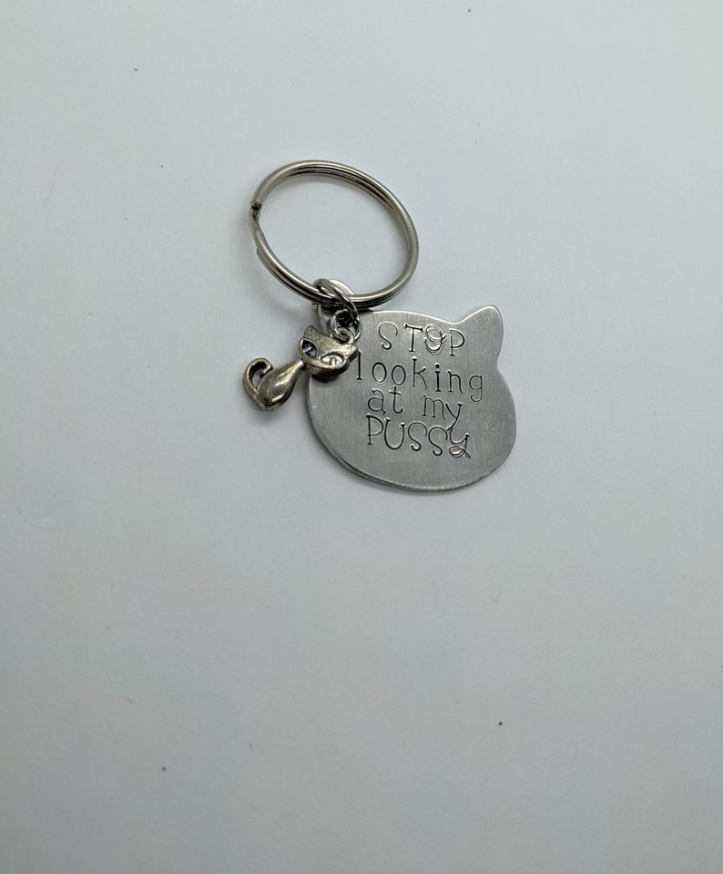 Hand-stamped aluminum cat-shaped keychain