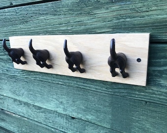 Cast Iron Dog Tail Hooks on a Waxed Oak Plinth