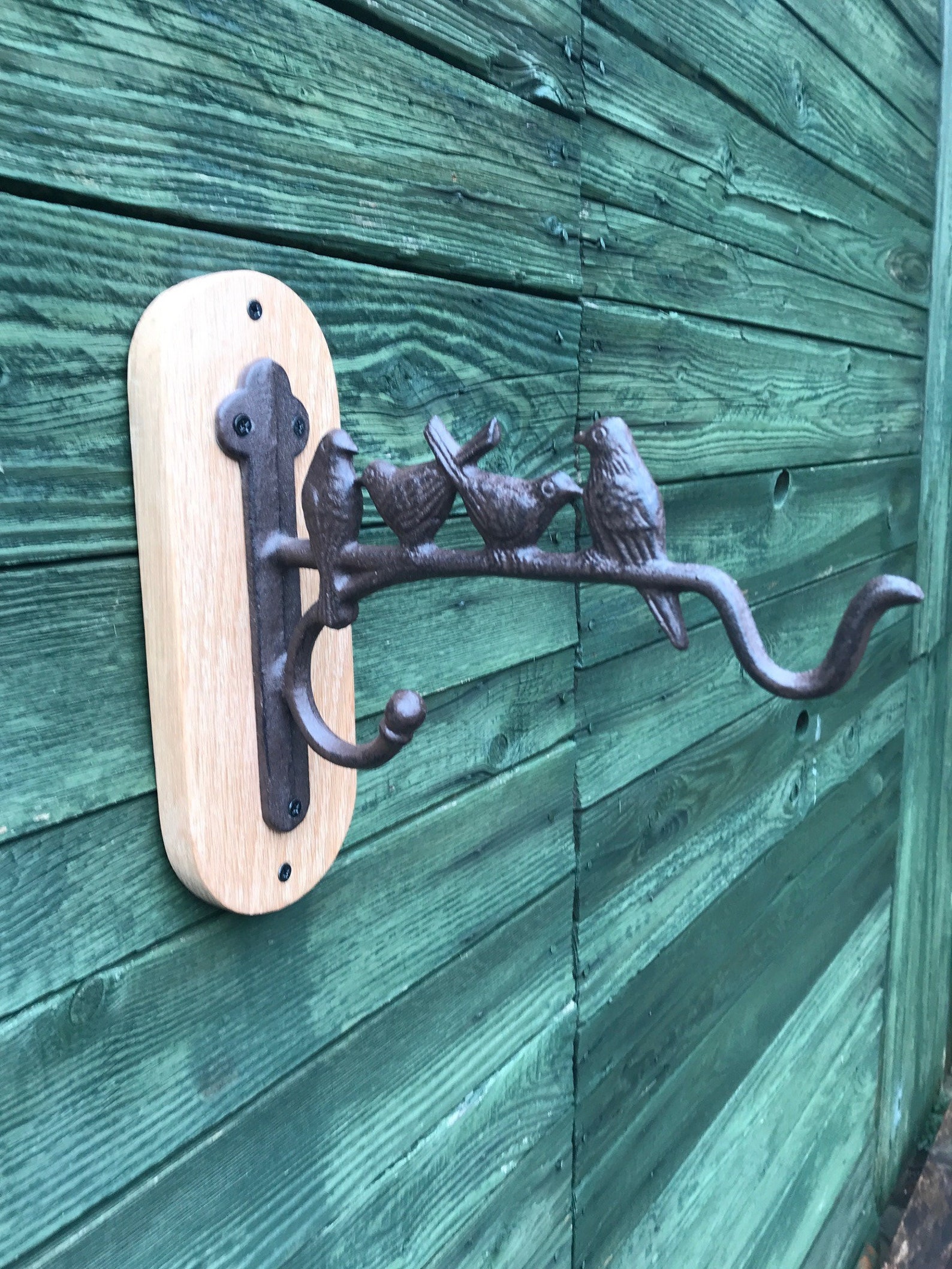 Cast iron hanging basket bracket with birds mounted on a Etsy