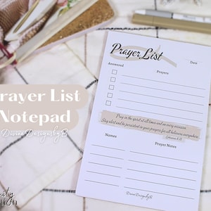 May include: White notepad with a beige prayer list design. The notepad has a section for answered prayers, prayers, names, and prayer notes. The notepad also includes a scripture quote: "Pray in the spirit at all times and on every occasion. Stay alert and be persistent in your prayers for all believers everywhere." Ephesians 6:18