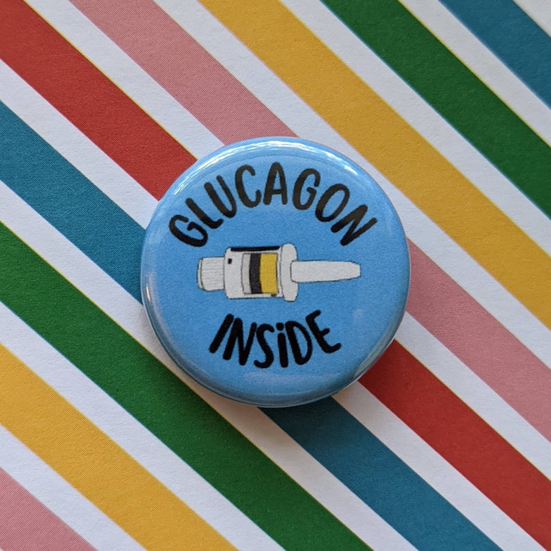 May include: A blue button with the text "Glucagon Inside" and a cartoon image of a glucagon pen.