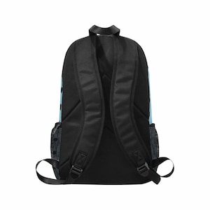 May include: Black backpack with padded shoulder straps and a top handle. The backpack has a light blue accent with black polka dots on the side. Features two side mesh pockets and adjustable straps.
