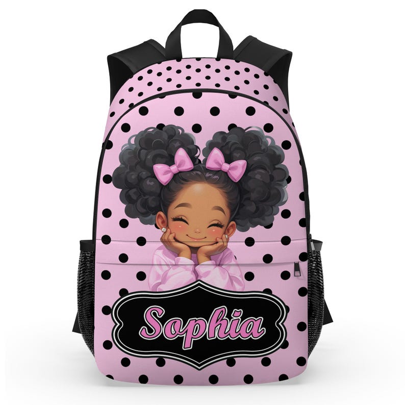 May include: Pink backpack with black polka dots and black trim. The front features a smiling cartoon girl with curly hair and pink bows. The name "Sophia" is displayed in a black and white frame.