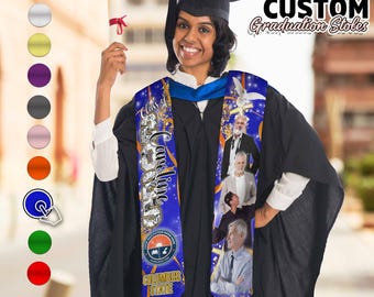 May include: A blue graduation stole with gold lettering that says "Class of 2023" and "Caroline". The stole also features a white dove, a gold cross, and a logo for Columbus State University. The stole is worn by a person wearing a black graduation gown and a black cap.