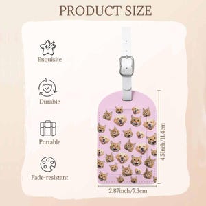 May include: A pink luggage tag featuring a repeating pattern of dog and cat faces. It has a white strap and buckle. The tag measures 11.4 cm high and 7.3 cm wide. The tag is labelled as "Exquisite", "Durable", "Portable", and "Fade-resistant".