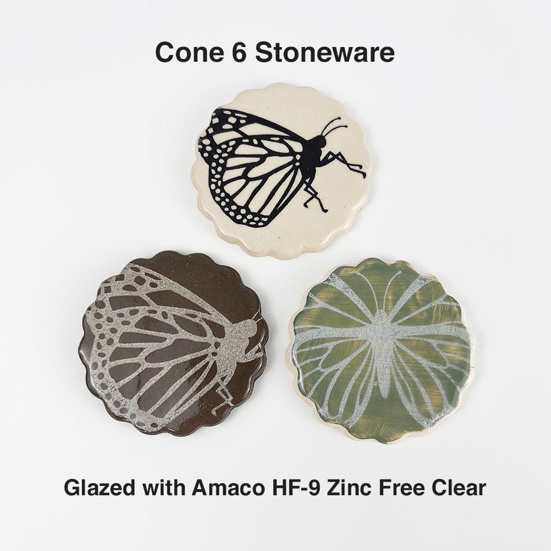 May include: Three ceramic coasters with a butterfly design. The coasters are glazed with Amaco HF-9 Zinc Free Clear glaze. Cone 6 stoneware.