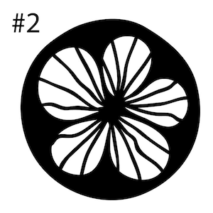 May include: Black and white silhouette of a stylized flower with a circular outline. The flower has a central circle and multiple petals with lines radiating from the center.