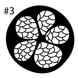 May include: Black and white design of a flower with five petals, each petal has a pattern of overlapping scales. The design is on a black circle with a white background.