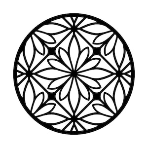 May include: A black, circular decorative element with a floral pattern. The design features a central flower surrounded by other floral shapes, all enclosed within a circular frame. The image is a high-contrast, black and white design.
