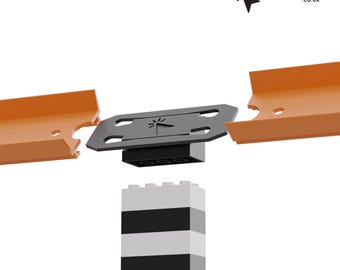 May include: A black plastic connector piece with a logo that says "Clickprints.co.uk" is attached to two orange plastic track pieces. The connector piece is attached to a white and black Lego block.