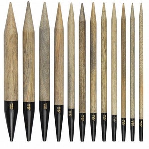 May include: A set of 12 interchangeable circular knitting needles in various sizes, ranging from US 4/3.5mm to US 17/12mm. The needles are made of wood and have black tips. Each package includes two needle tips.