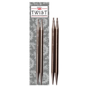 May include: Set of three interchangeable knitting needles, made of metal, with a silver finish. The needles are packaged on a card with the brand name "Twist" printed on it.