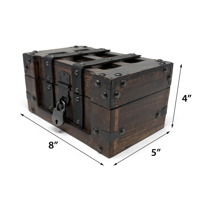 May include: A small, dark brown wooden chest with metal accents and a lock. The chest measures 8 inches long, 5 inches wide, and 4 inches high. It has metal corner brackets and straps, giving it a vintage look.