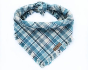 Dusty blue plaid bandana with frayed edges and snaps