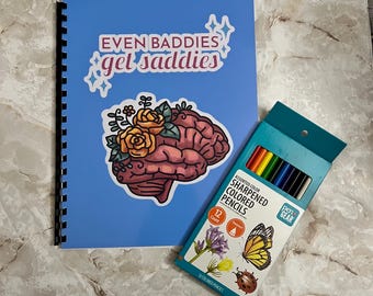 May include: A blue spiral bound notebook with the text "EVEN BADDIES get saddies" and a sticker of a brain with flowers. A box of 12 assorted color sharpened colored pencils with a butterfly and ladybug design.