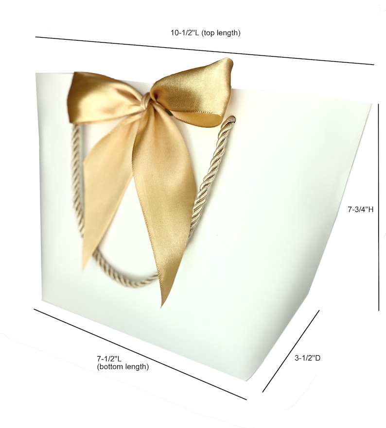 May include: White gift bag with a gold satin bow and rope handles. The bag measures 10.5 inches long at the top, 7.5 inches long at the bottom, 3.5 inches deep, and 7.75 inches high. Ideal for gifts and special occasions.