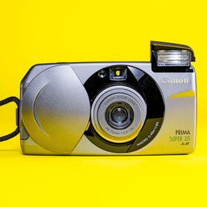 Fotocamera a pellicola CANON PRIMA SUPER 28 Canon 35 mm punta e scatta Canon vintage 35 mm