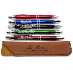 May include: Set of five personalized pens in red, blue, black, green, and burgundy with silver accents. The pens are in a brown leather case with the text "Ms. Rose Richmond High Law Academy" engraved on the case.