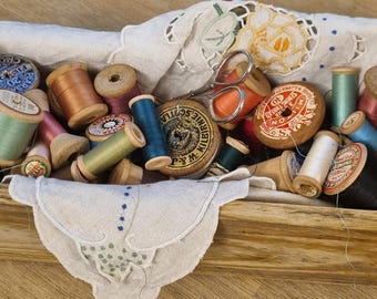 Vintage wooden box with wooden cotton reels