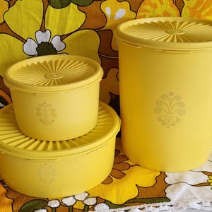 Vintage set of three bright yellow Tupperware containers