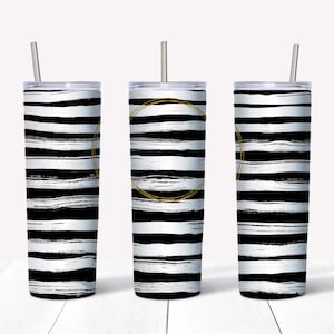 May include: Three stainless steel tumblers with black and white striped designs and gold accents. The tumblers have lids and straws.