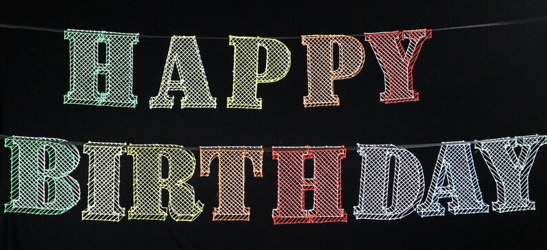 May include: A colorful Happy Birthday banner with a mesh-like design. The letters are in different colors, including green, yellow, orange, red, and blue.