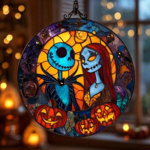 May include: Circular stained glass window depicting Jack Skellington and Sally from The Nightmare Before Christmas. The artwork has a blue, orange, purple, and red colour scheme. Three carved pumpkins are at the bottom. The window is suspended by a decorative metal chain.