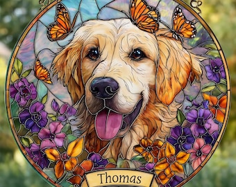 May include: Round stained glass window featuring a Golden Retriever with butterflies and flowers. The dog's name, "Thomas," is on a banner. The artwork has a colorful, detailed design with a chain for hanging.