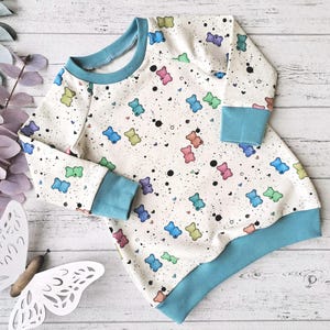 Bunte Gummibärchen-Tunika für Mädchen, Sweatshirt mit Gummibären in Tunikalänge, verschiedene Bündchenfarben, Wunschgröße 74 - 122