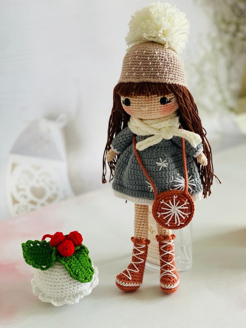 Handmade Crochet Festive Doll with winter clothes and snowflakes,Crochet Winter Doll with snowflake pattern, Handmade Crochet Snowflake Girl in festive winter clothes,Crochet Festive Doll with snowflake detail, with cute snowflake outfit"