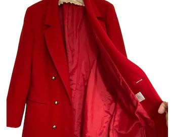 May include: A vibrant red blazer with a double-breasted design and gold-colored buttons. The interior lining is also red. The blazer is displayed open, showcasing the inner lining and construction. A classic piece of outerwear.