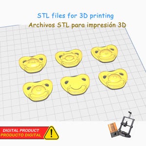May include: Yellow 3D-printed pacifier models arranged on a grid, with the text "STL files for 3D printing" and "DIGITAL PRODUCT" visible. A 3D printer is in the background.