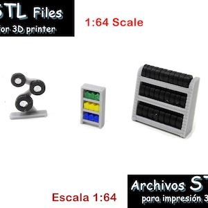 May include: Three 3D printed models for a 1:64 scale model train set. The models are a tire rack, a shelf with colorful boxes, and a tire stand. The models are printed in gray plastic with black tires. The text "STL Files for 3D printer" and "1:64 Scale" is visible in the image.