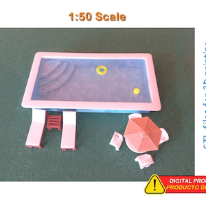 May include: A miniature 3D-printed pool scene, including a rectangular pool, two sun loungers, a small parasol, and other accessories. The pool has blue water and a yellow float. The text "1:50 Scale" is visible.