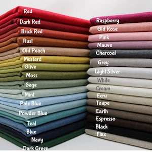 May include: A stack of fabric swatches in various colors, including red, pink, green, blue, and brown. The fabric swatches are labeled with their color names.