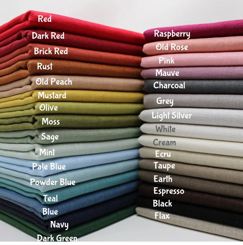 May include: A stack of fabric swatches in various colors, including red, pink, green, blue, and brown. The fabric swatches are labeled with their color names.