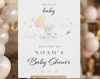 May include: A white sign with a cute cartoon lamb holding balloons. The sign says "Hello baby, Welcome to Noah's Baby Shower 06.07.24".