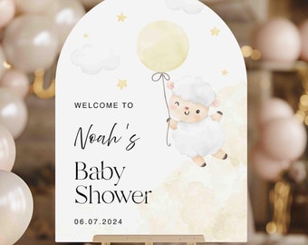 May include: Welcome to Noah's Baby Shower sign with a white sheep holding a yellow balloon, clouds, and stars on a white background. The date 06.07.2024 is printed below the text.