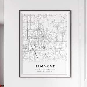 May include: Black and white line art map of Hammond, Louisiana. The map shows the city streets and includes the city name and coordinates: 30.5044°N - 90.4612°W.