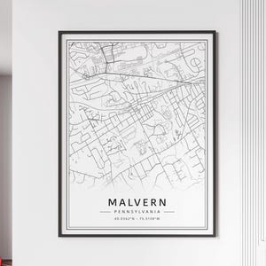 May include: Black and white line art map print of Malvern, Pennsylvania. The map shows the streets and roads of the town. The text at the bottom of the map reads "Malvern, Pennsylvania, 40.0362°N - 75.5138°W".