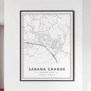 May include: A black and white line art map of Sabana Grande, Puerto Rico. The map shows the city streets and surrounding area. The text "Sabana Grande - Puerto Rico - 18.0814°N - 66.9654°W" is printed below the map.