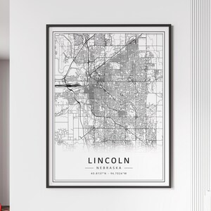 May include: Black and white city map print of Lincoln, Nebraska. The map shows the city streets and landmarks. The text "LINCOLN - NEBRASKA 40.8137°N - 96.7026°W" is printed below the map.