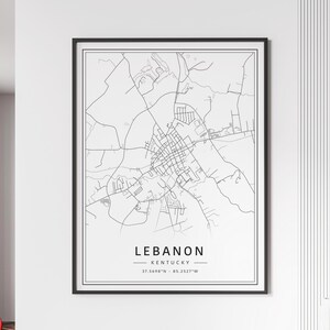 May include: Black and white line art map of Lebanon, Kentucky. The map shows the city streets and surrounding area. The text "Lebanon, Kentucky" and the coordinates "37.5698°N - 85.2527°W" are printed below the map.