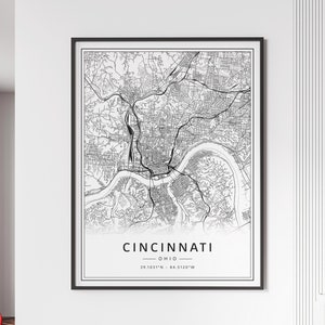 May include: Black and white map print of Cincinnati, Ohio with the city's name and coordinates: 39.1031°N - 84.5120°W.