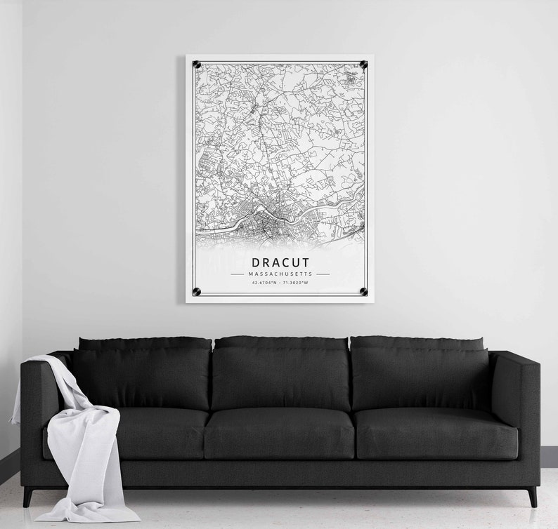 May include: Black and white line art map print of Dracut, Massachusetts. The map shows the city streets and features the city name and coordinates.