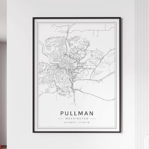 May include: A framed black and white map print of Pullman, Washington. The map shows the city's layout with streets and landmarks. The city name and state are printed in a clean, modern font at the bottom, along with the coordinates.