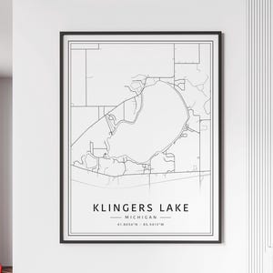 May include: A black and white line art map of Klinger's Lake in Michigan. The map shows the lake and surrounding roads. The text "Klinger's Lake" is printed below the map, along with the coordinates "41.8056°N - 85.5413°W".