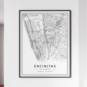 May include: A black and white line art map print of Encinitas, California. The map shows the streets and roads of the city. The text "Encinitas, California" and the coordinates "33.0370°N - 117.2920°W" are printed below the map.